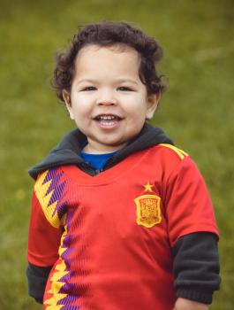 Portrait of boy wearing Manchester United football team jersey - Little Dribblers
