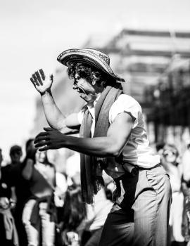 Man with a hat dancing in the street at Cuba Dupa 2021 bokeh monochrome