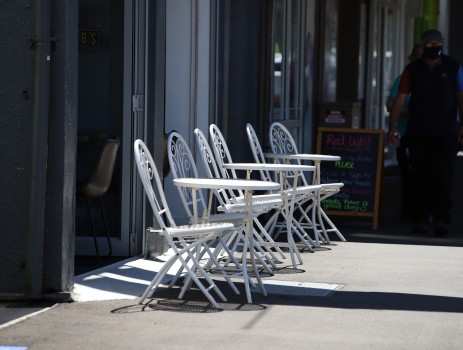 Tables and chairs outside a cafe
