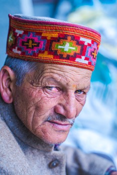 Old man with wrinkles and traditional cap