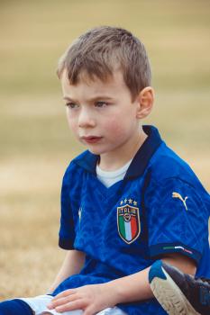 Blue eyed kid in Italia kit at Little Dribblers soccer game