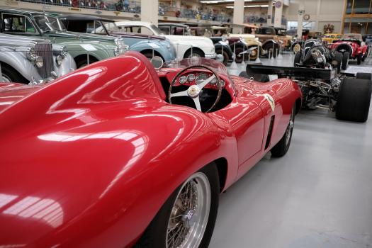 Red Ferrari classic race car at a museum