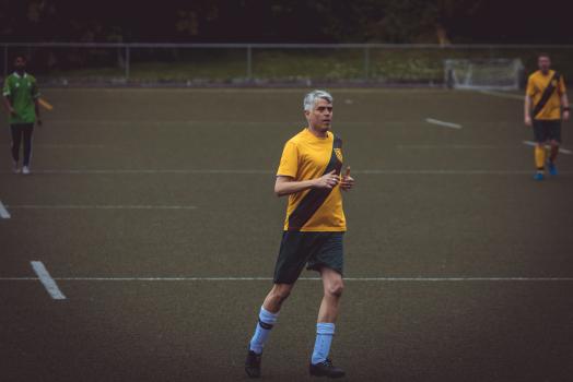 White haired football player in yellow shirt - Sports Zone sunday league