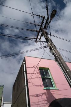 Pink facade of a building and electric pole at Newtown festival 2021