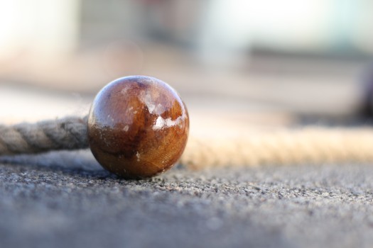 Close-up of bead on asphalt, R4L 2022