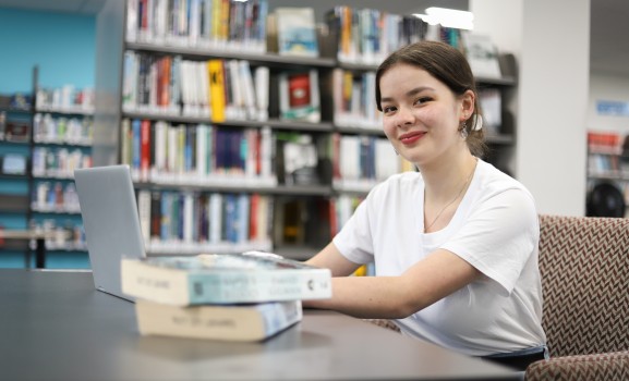 Girl in library looking at you