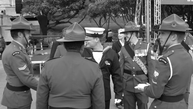 Group of soldiers gathered at National War Memorial monochrome