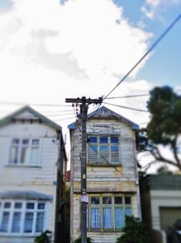 Wooden double story house and electric pole