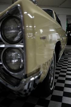Classic cream Plymouth Commando vertical stacked headlights