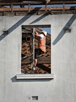 Construction worker through a window
