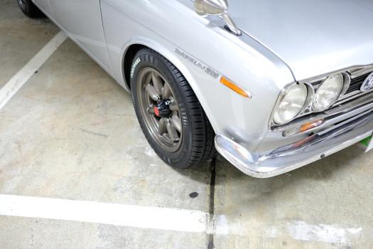 Classic silver Datsun 1600 headlights grille and turn signal