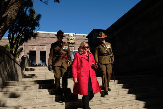 Uniformed soldiers escorting a lady on Anzac Day 2017