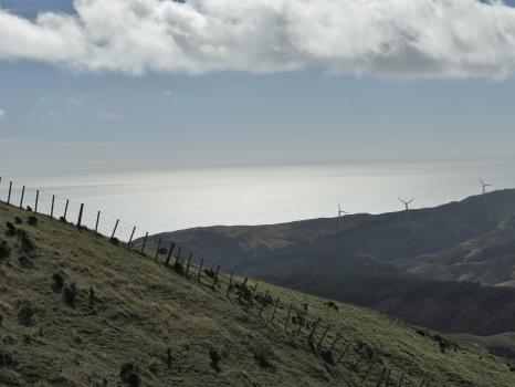 Fencing on grassy mountains and wind turbines Ohariu Wellington