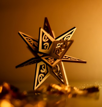Matariki star wooden ornament on table
