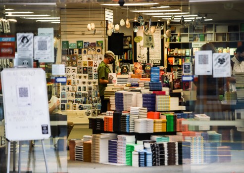 Guy browsing local bookshop