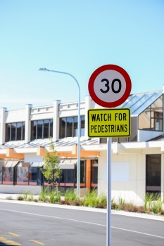30 speed limit and watch for pedestrians sign