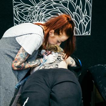 Redhead tattoo artist at Wellington tattoo convention 2021