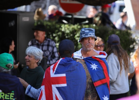 Guys wearing NZ flag capes - Convoy 2022