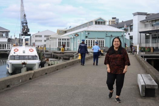 Smiling woman walking on pier