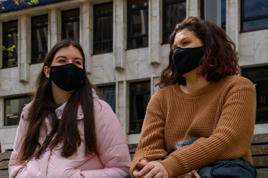Two women with masks on