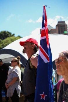 Guy with closed eyes, NZ flag - Convoy 2022