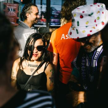 Tattooed woman wearing shades and a corset at Newtown festival 2021