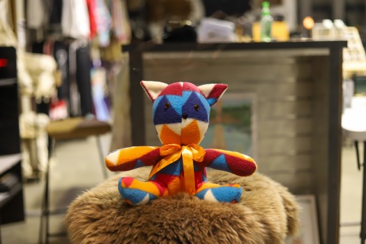 Multi coloured stuffed toy in a shop