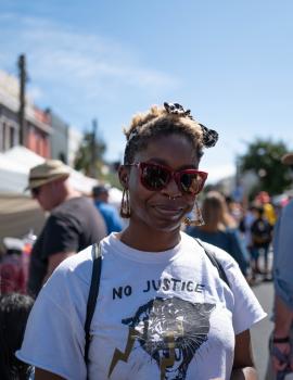 Woman wearing red glasses and white shirt at Newtown Festival 2020