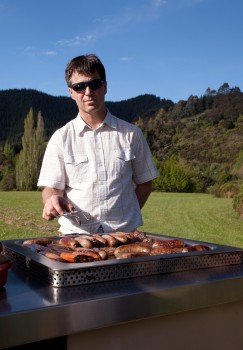 South African man at outdoor barbeque