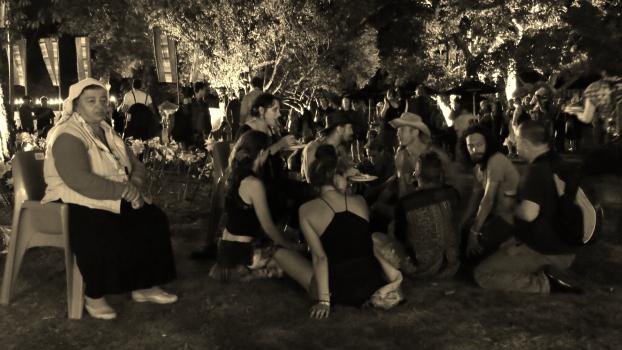 Group of friends gathered around at WOMAD festival