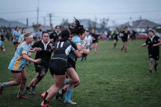 Women's rugby sports action shot