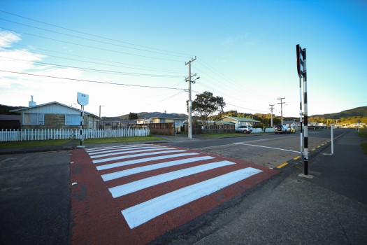 Red and white zebra crossing on a street