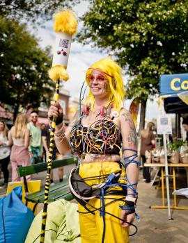Yellow haired woman tangled in wires at Newtown festival 2021