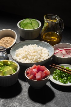 Rice bowl, meat, vegetables, fruits and oil