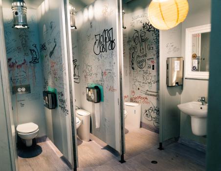 Bathroom stalls decorated with graffiti China paper lantern