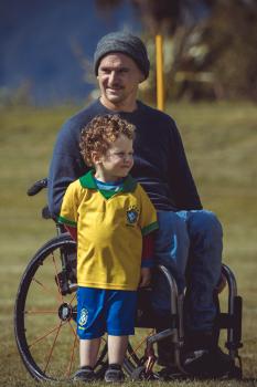 Little boy with dad in wheel chair - Little Dribblers