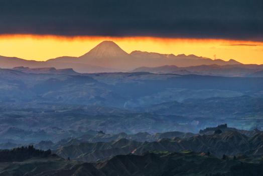 Sunrise from Rangiwahia Hut to the volcanoes