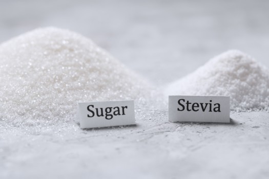 Sugar grains and stevia powder mounds