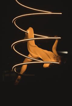 Artistic acrobatics with a lighting spiral structure