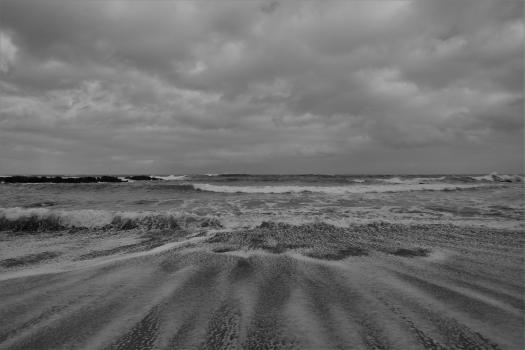 Cloudy day and waves at the beach black and white
