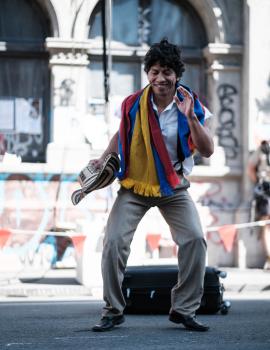 A happy man dancing in the street at Cuba Dupa 2021 bokeh