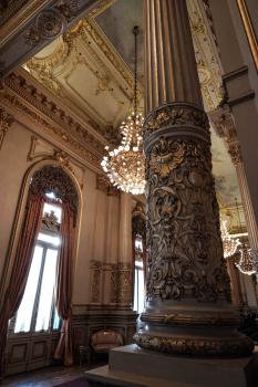 Beautiful interior design of a building with chandeliers and pillars