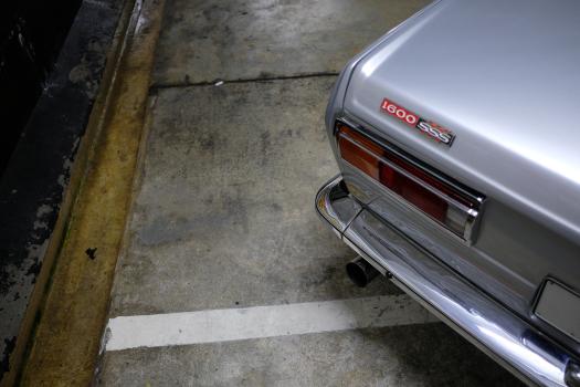 Classic silver Datsun 1600 SSS tail light bumper and exhaust