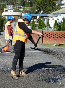 Woman laying asphalt
