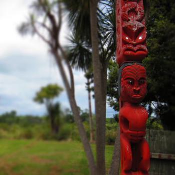 Maori totem pole and grass