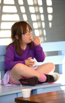 Girl with Down syndrome eating ice cream