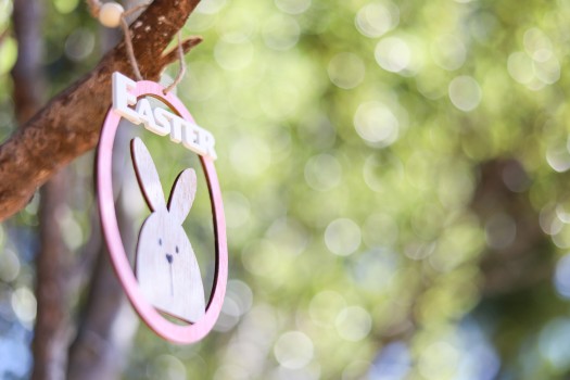Wood carved Easter rabbit ornament on a branch