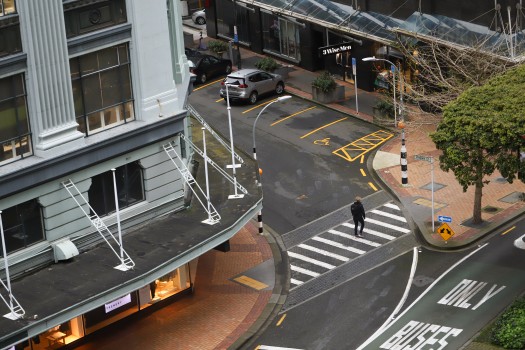 Woman crossing street aerial view