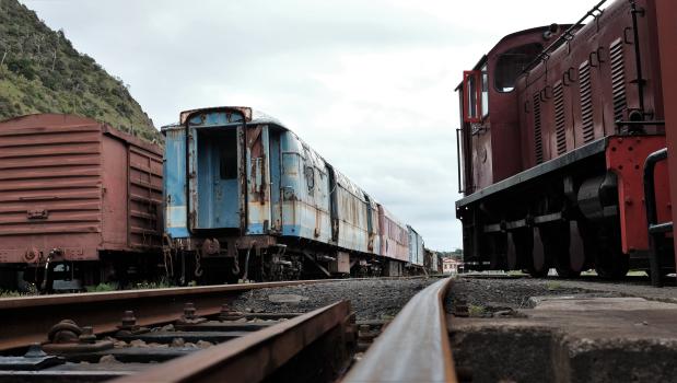 Abandoned blue and red trains