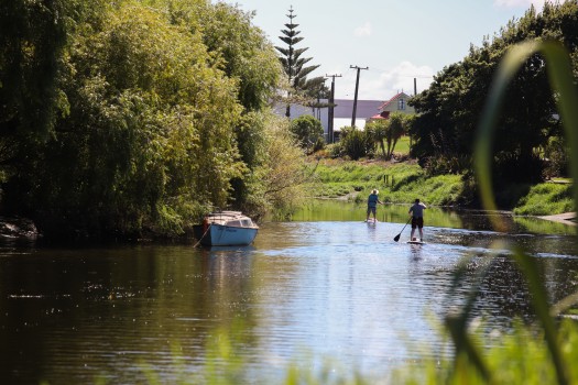 Paddling on surf boards in the canal